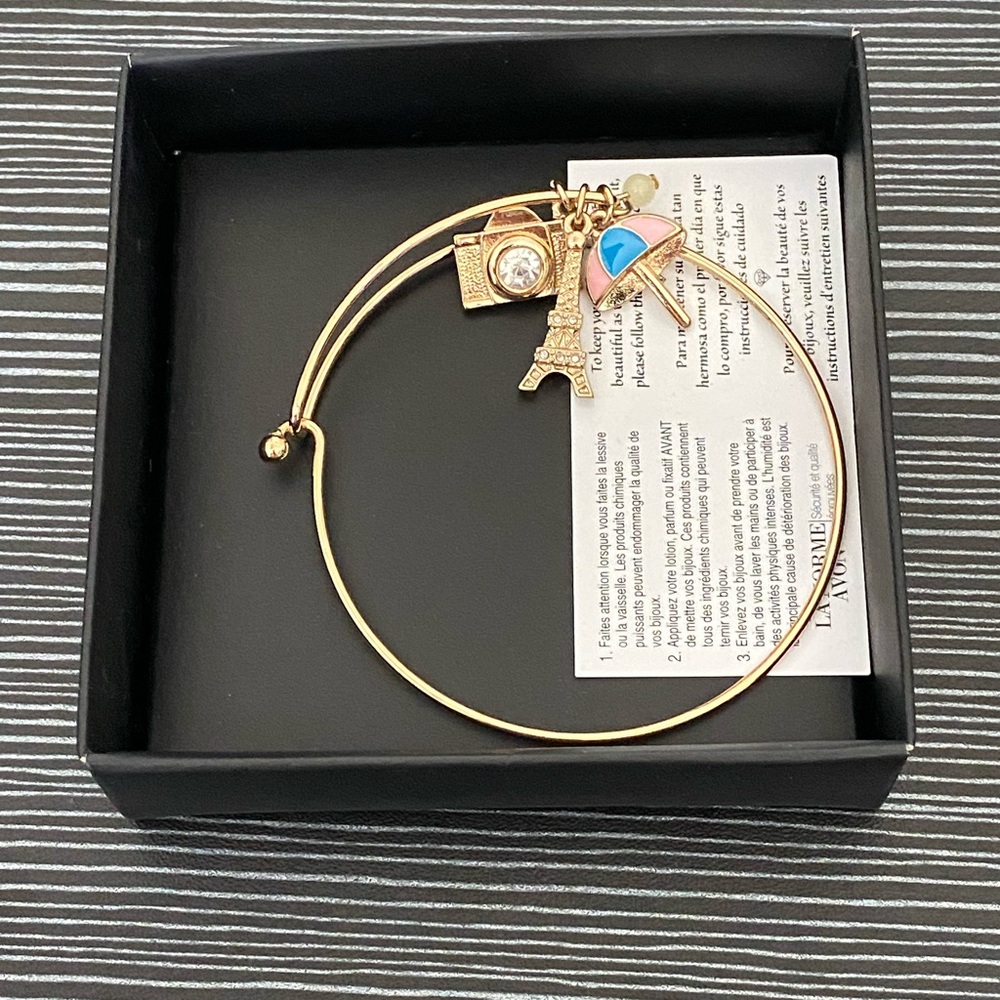 Avon Gold Bracelet with Eiffel Tower, Beach Umbrella, and Camera Charms